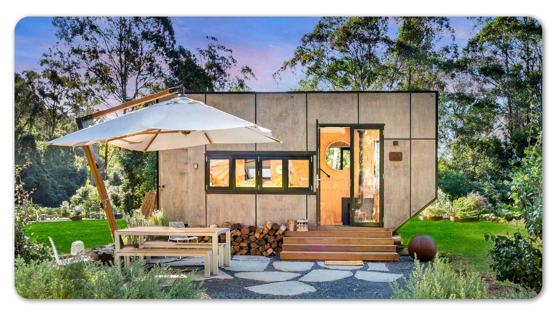 Photo of modern tiny home with outdoor camping area